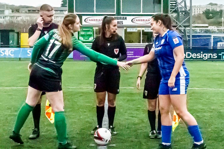 Aber captain Amy Jenkins shakes hands with her Cardiff City counterpart Siobhan Walsh