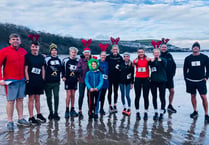 Reindeer runners dash through the sand for New Quay RNLI