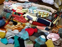 WI's Catty Crafters knit 125 winter warmers for those in need