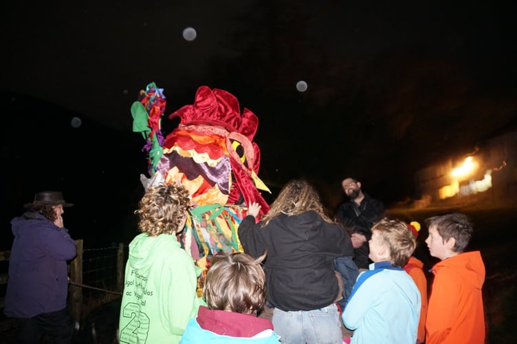 The lantern is lit at the top of Esgairgeiliog hill
