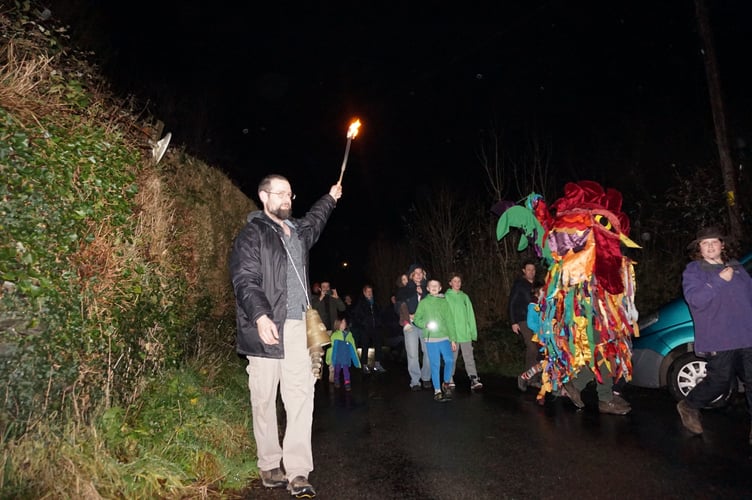 Jonathan Gross (right) and the Ceiliog leading the procession down the hill