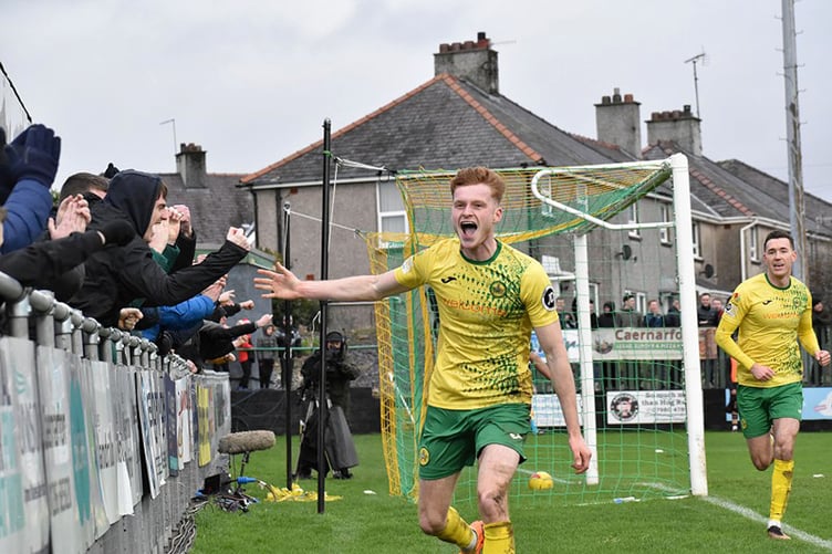 Zack Clarke celebrates scoring Caernarfon’s second goal against Colwyn Bay