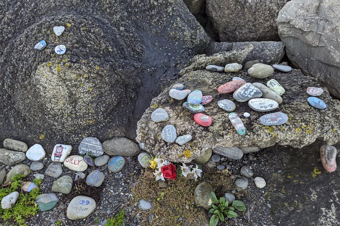 Stones gathered by the rock berm on the north shores of Tywyn beach