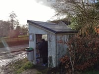 Community transforms disused bus shelter into library