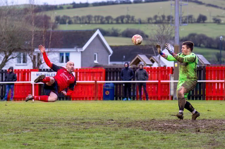 Geoff Kellaway scored twice for Penrhyncoch and was shown a red card in an eventful cup tie at Cae Baker