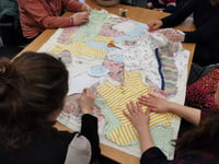 Mothers sew quilt to promote infant feeding discussions 