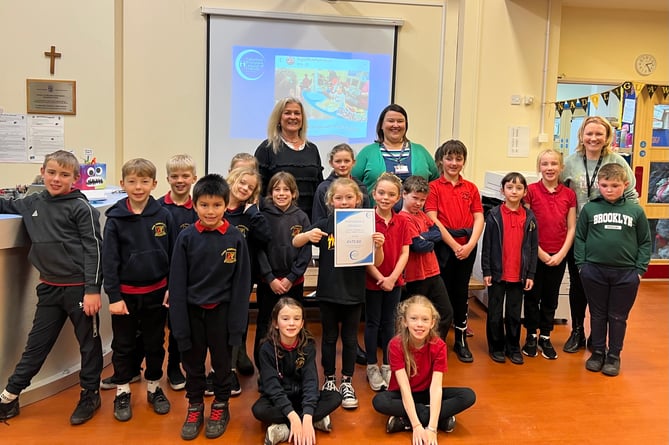 Elinor Powell and Rhian Davies from Cyfeillion Bronglais League of Friends with pupils from Class 3 at Ysgol Penrhyncoch and their teacher Fflur Jones