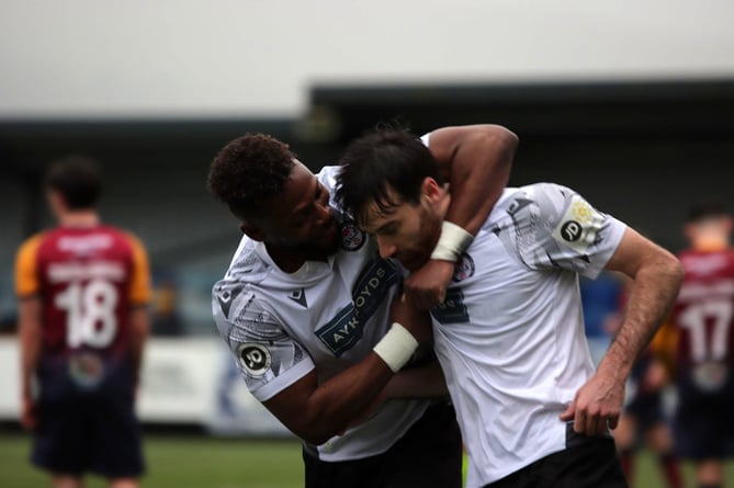 George Newell is congratulated after scoring Bala’s equaliser against Cardiff Met