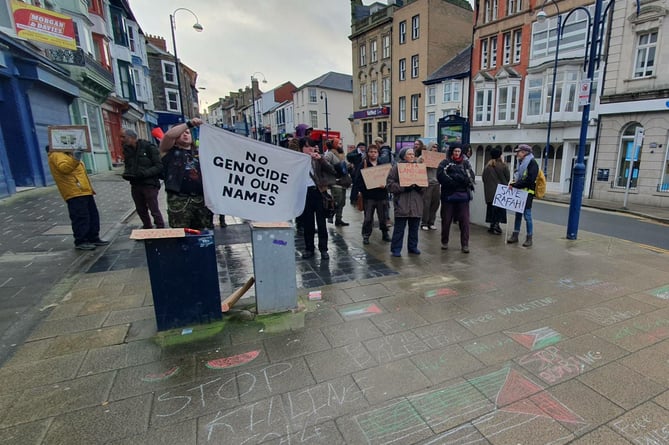 Pro-Palestine mantras and flags were drawn on the pavement in chalk
