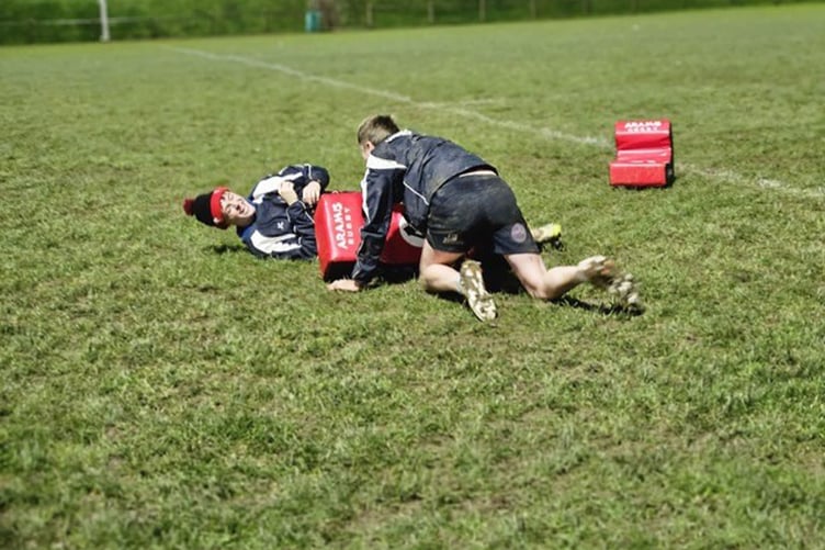 Getting to grips with the new training kit are coach Jac Lloyd and Steffan Davies