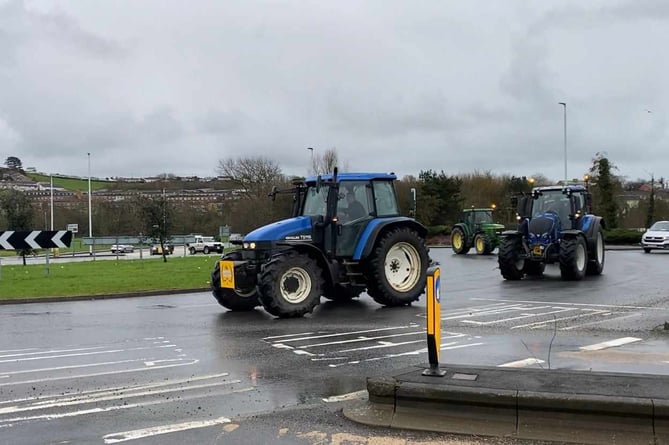 Farmers arrive on tractors to take part in the protest