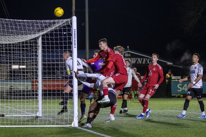 BALA, WALES - 1ST MARCH 2024: Bala Town Goalkeeper Kelland Absalom palms the ball over the bar at the JD Cymru Premier Championship Conference fixture between Bala Town and Connah's Quay Nomads at Maes Tegid, Bala. 1st of March, Bala, Wales (Pic by Nik Mesney/FAW)