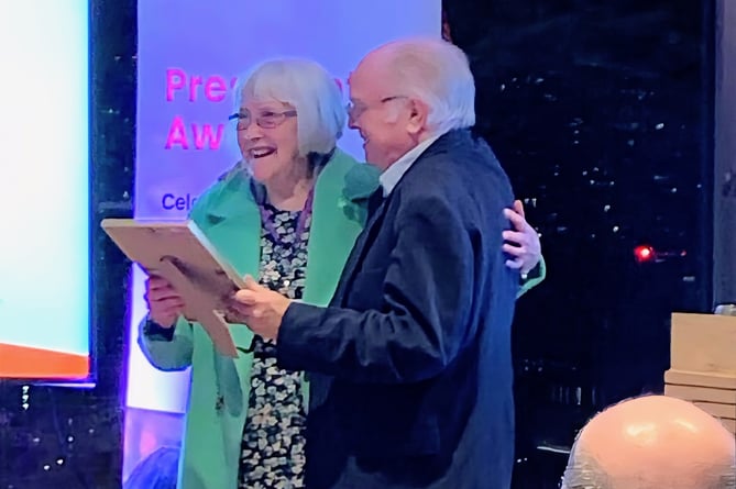 Ann Hughes received her award from Richard Attenborough’s son, Michael