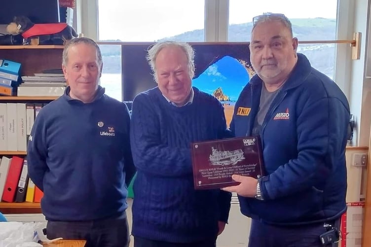 Stourbridge RNLI Fundraiser presenting plaque to Daniel Potter (right) and Bernie Davies (left)