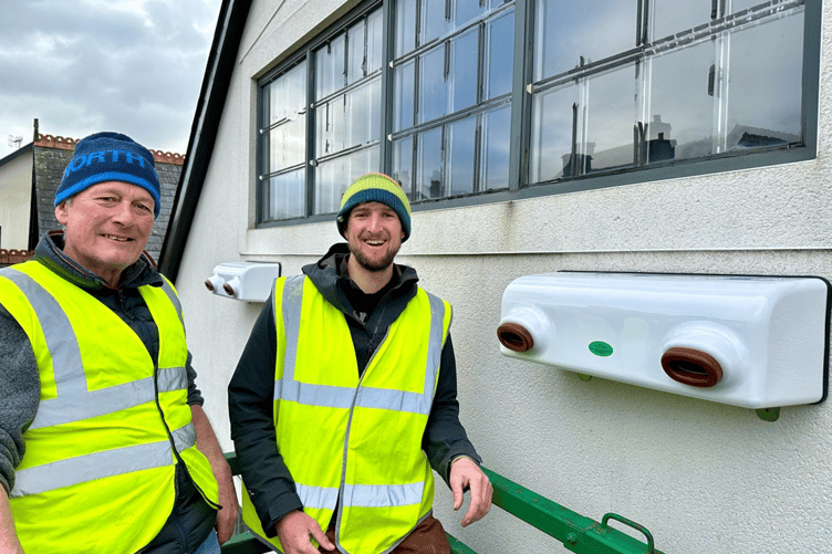 Ben Porter and other Swift Project volunteers installing swift boxes on the Machynlleth Co-op store