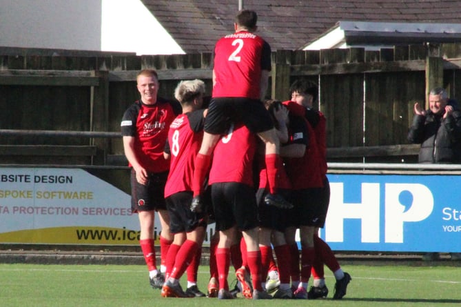 Celebrations after Isaac Pridmore doubles Penrhyncoch's lead