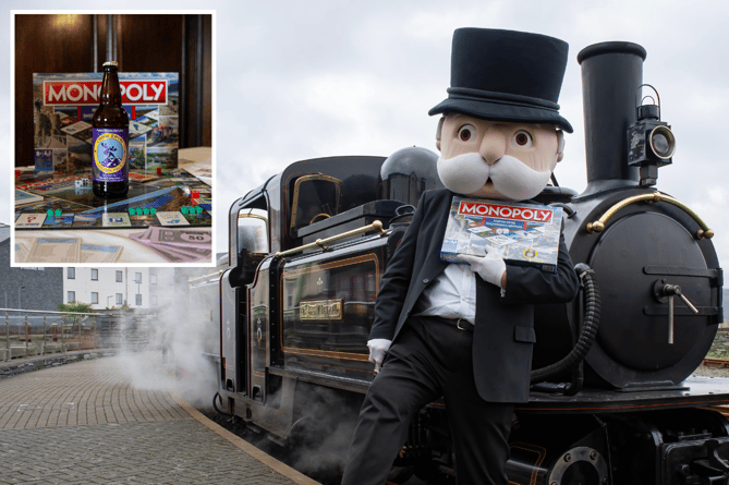 Mr Monopoly and the new Eryri/Snowdonia Edition, alongside Double Fairlie engine, James Spooner, at Porthmadog Harbour Station, Ffestiniog Railway. Photo: Chris. Parry. Inset: Purple Moose also appears on the board