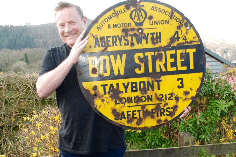 Dave Reed, a member of the Hall committee, holding the sign