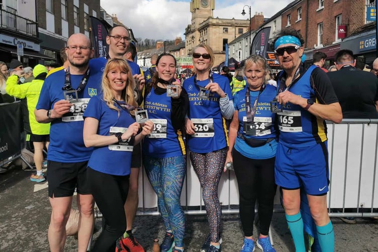 Aber AC runners celebrate at Welshpool with their medals