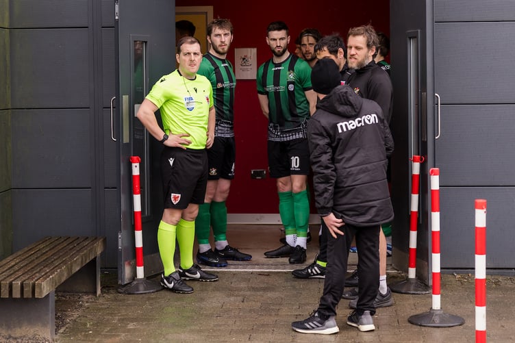 PONTYPRIDD, WALES - 09 MARCH 2024: Officials speak with players and coaches as the game is called off due to Aberystwyth not having a physio during Phase 2 of the 2023/24 JD Cymru Premier league Playoff Conference fixture between Pontypridd United F.C & Aberystwyth Town F.C at USW Sports Park, Treforest, Wales (Pic by John Smith/FAW)