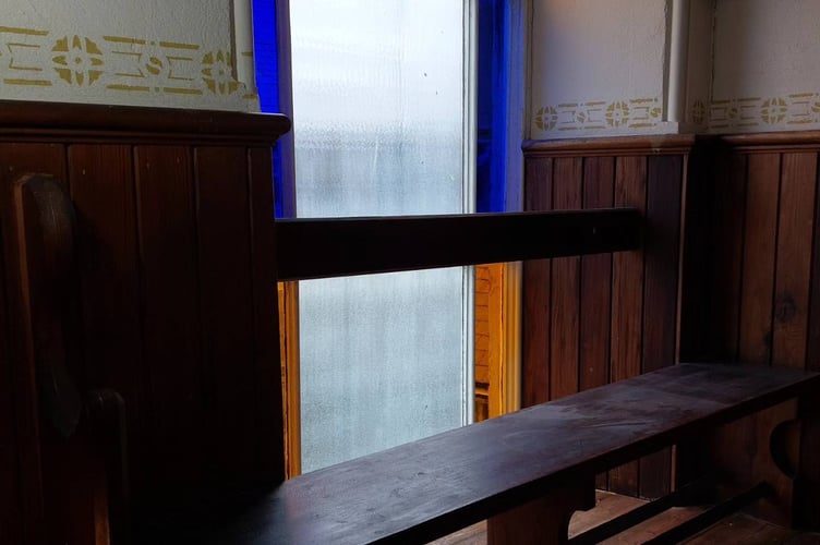 Where the pew sat before it was moved and the message uncovered
