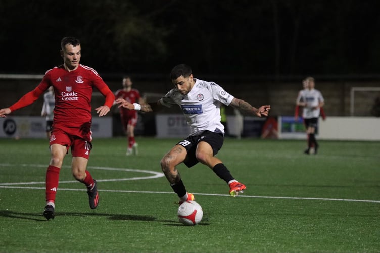 Bala's Naim Arsan is closely marked