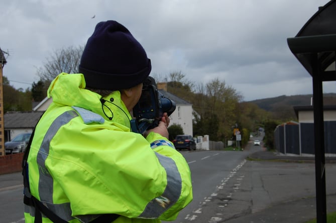 A speed enforcement officer at a new 20mph speed limit zone in Comins Coch near Aberystwyth