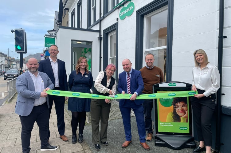 Liz Saville Roberts MP and Mabon ap Gwynfor MS, with Specsavers staff at the opening of the Porthmadog store