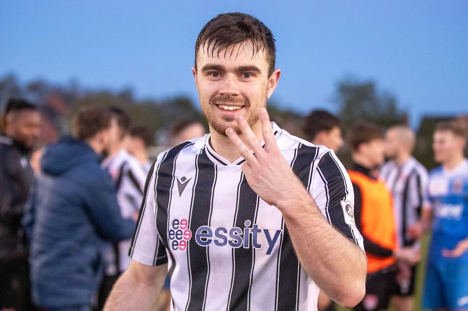 MOLD, WALES - 16 APRIL 2024: Flint Town United's Joshua Jones celebrates his hat-trick at full time following the JD Cymru North Fixture between Mold Alexandra and Flint Town United at Alyn Park, Mold on the 16th of April 2024. (Pic by Nik Mesney/FAW)