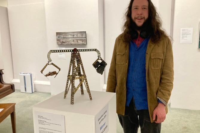 Daniel Jones with his award-winning piece, 'The Balance of Power'