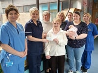 Church present baby unit with cheque to buy cot
