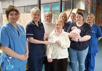 Gwynedd church present baby unit with cheque to buy cot