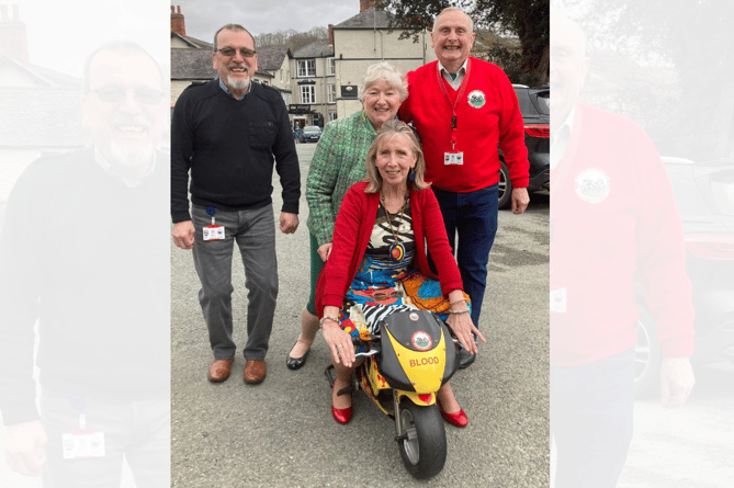 Tywyn Inner Wheel girls Mary Bowron & Jackie Windsor-Lewis trying out the mini Blood Bike at a recent District Meeting in Llangollen