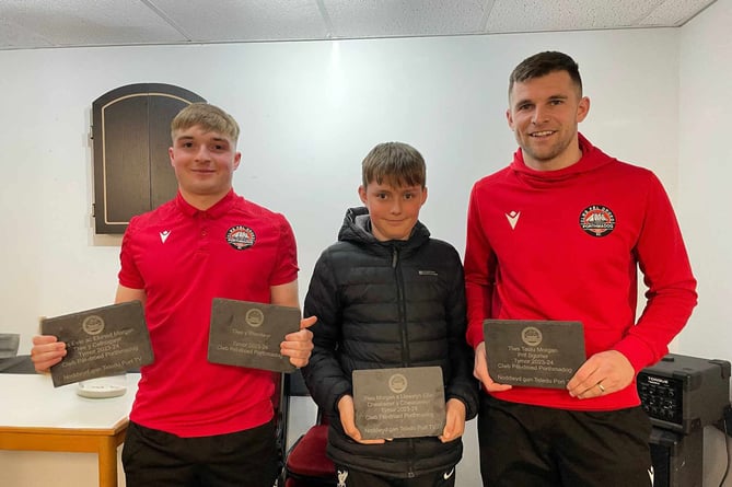 Morgan Ellis handing out trophies to Caio Evans (left) and Danny Brookwell (right)