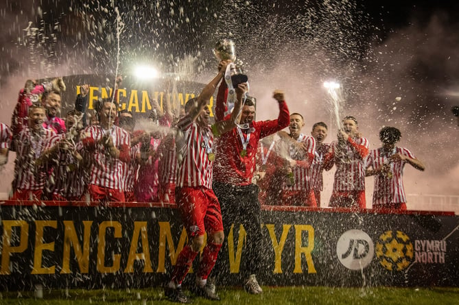 HOLYWELL, WALES - 24TH APRIL 2024: Holywell  Town celebrate being crowned JD Cymru North Champions following their 4-0 victory oer Llanidloes Town at the Achieve More Stadium, Holywell. 24th of April, Holywell, Wales (Pic by Nik Mesney/FAW)