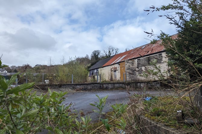The ex-Travis Perkins site in Machynlleth has been earmarked for housing development