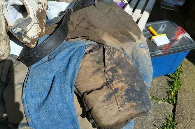 The muddy clothes Winston was found in. Image: Family photograph