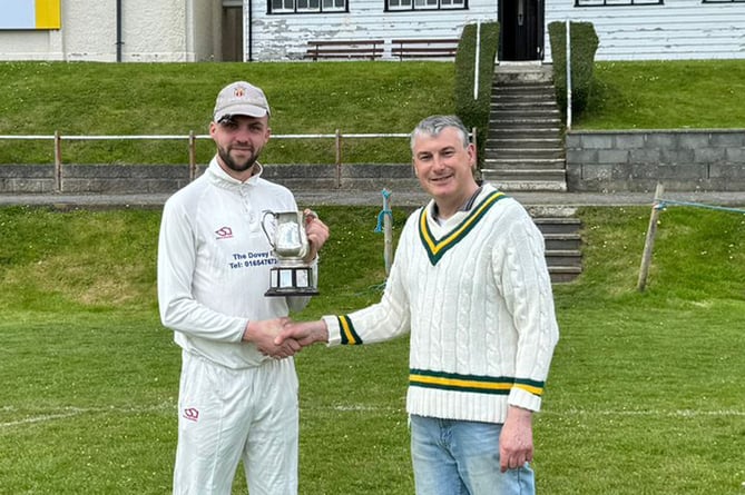 WWCCC chairman Huw Chambers presents the 2023 trophy to Dave Jenkins, captain of Tywyn CC