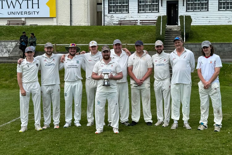 Tywyn Cricket Club celebrate receiving the 2023 WWCCC trophy prior to their first match of the season