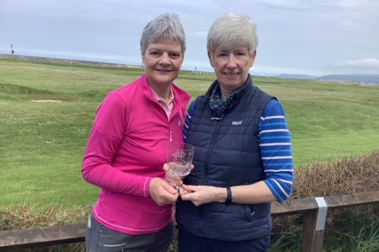 Debbie Jones being presented the Wilding Goblet Cup by Captain Catrin Pugh Jones