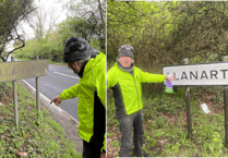 Father and son clean Ceredigion village signs