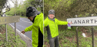 Father and son clean Ceredigion village signs