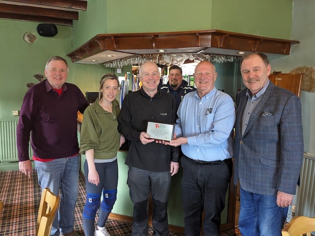 The pub has received a plaque from Pub is The Hub recognising its important role at the heart of its community. (Left to right: Alwyn Jones, committee member, Zoe Smith, publican, Huw Antur, committee secretary, Jonathan Smith, publican, Pub is The Hub regional advisor for Wales Malcolm Harrison, and Elfyn Llwyd, committee member