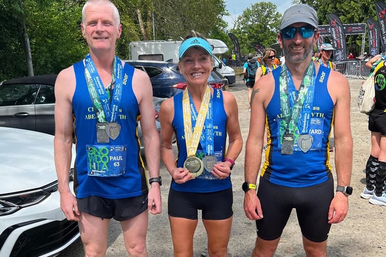 Paul, Lynwen and Edd celebrating with their medals