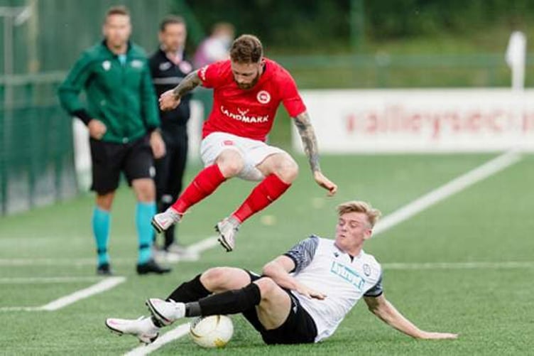 Bala's Will Evans slides in for a tackle during their 1-0 defeat against Larne back in the 2021-22 season