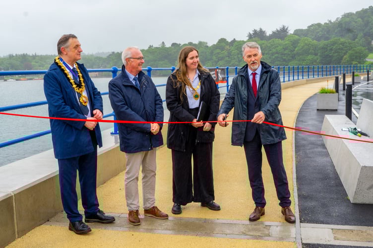 Welsh Government Cabinet Secretary for Climate Change and Rural Affairs, Huw Irranca-Davies cutting the ribbon on the new defences, with Cllr Beca Roberts, Chair of Cyngor Gwynedd; Cllr Medwyn Hughes, former Chair of Gwynedd Council; and Bangor City Mayor, Cllr Gareth Parry