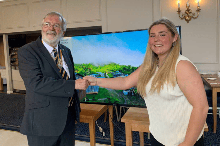 Millie Hore with club President, Eric Robinson