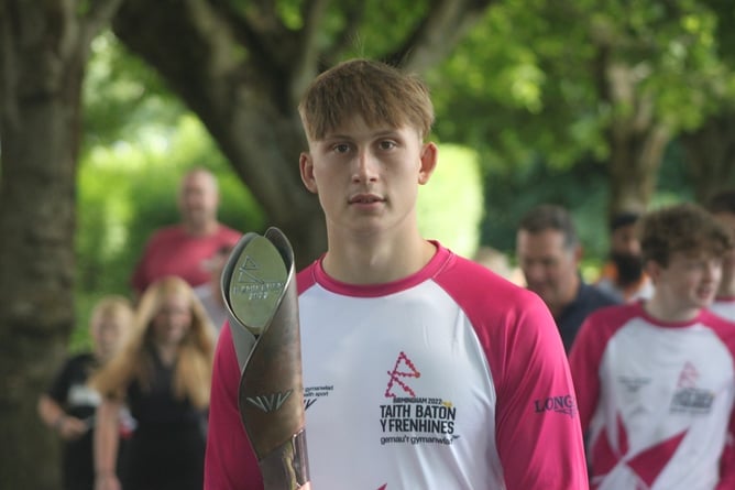 Josh Hathaway carrying The Queen’s Baton in Aberystwyth