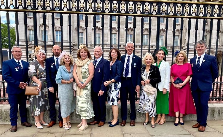 Group photo of RNLI volunteers and their families at Buckingham Palace. Photo: Pwllheli RNLI