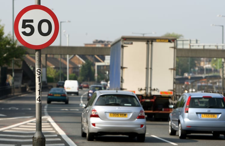 Cars pass a 50mph speed limit sign on the A3 in New Malden, south west London. Wide-ranging proposals to dramatically cut the number of deaths on the roads were set out by Road Safety Minister Jim Fitzpatrick today as he also confirmed a major overhaul of the driver training and testing process.